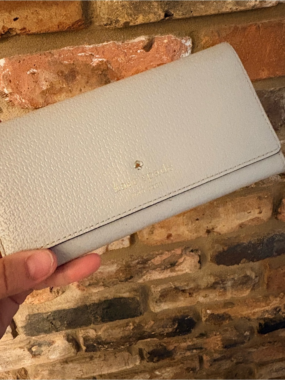 kate spade pebble leather long wallet in light gray